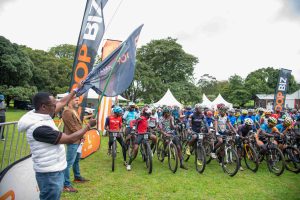 NCBA GMD John Gachora flags off cyclists during the opening leg of the 2026 LOOP Safari Gravel Series at Limuru Country Club (1) (1)