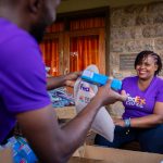 FedEx colleagues prepare hygiene kits for children and families in need.
